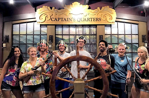 Adian and crew pose at the photo opportunity space in the Pirate's Treasure Museum